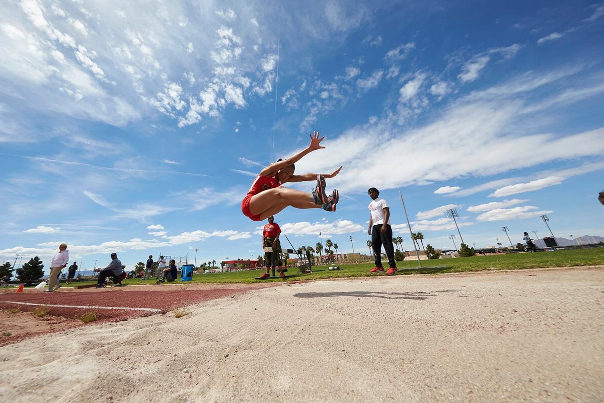 Student performing the long jump